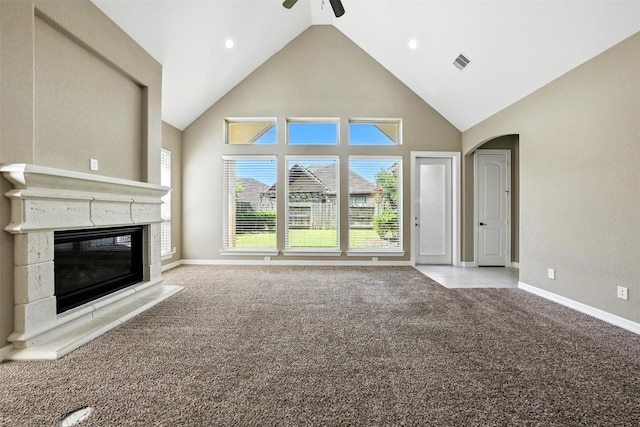 4914 Fairford Dr, Sugar Land, TX 77479 - unfurnished living room featuring carpet, high vaulted ceiling, a glass covered fireplace, arched walkways, and a ceiling fan