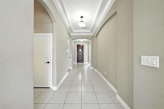 4914 Fairford Dr, Sugar Land, TX 77479 - hall with arched walkways, crown molding, a textured wall, and light tile patterned floors