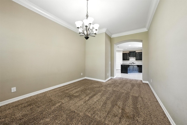 4914 Fairford Dr, Sugar Land, TX 77479 - empty room with crown molding, a chandelier, arched walkways, and light carpet