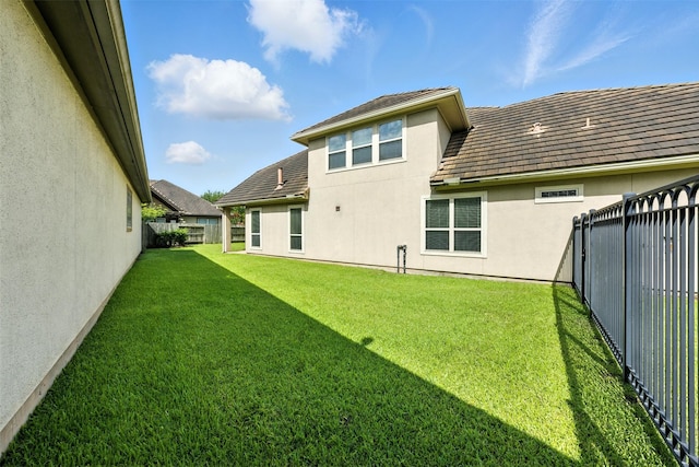 4914 Fairford Dr, Sugar Land, TX 77479 - back of house featuring stucco siding and a fenced backyard