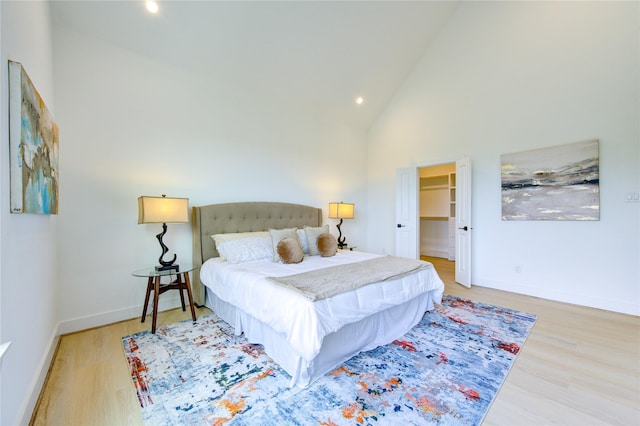 2312 Reinerman St, Houston, TX 77007 - bedroom with wood finished floors, high vaulted ceiling, recessed lighting, baseboards, and a spacious closet