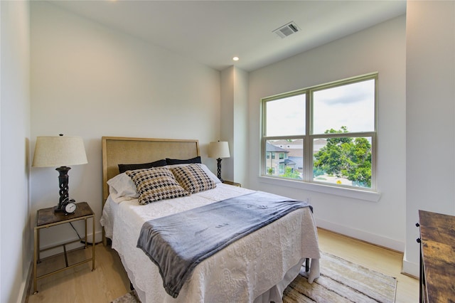 2312 Reinerman St, Houston, TX 77007 - bedroom with baseboards, light wood-type flooring, and recessed lighting