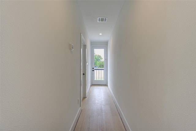 2312 Reinerman St, Houston, TX 77007 - hall featuring light wood-style floors, baseboards, and recessed lighting