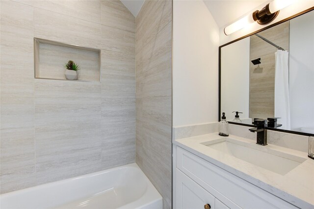 2312 Reinerman St, Houston, TX 77007 - bathroom featuring vanity, shower / bath combination with curtain, and lofted ceiling