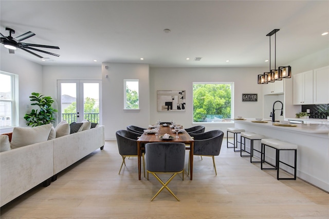 2312 Reinerman St, Houston, TX 77007 - dining room featuring recessed lighting, plenty of natural light, light wood finished floors, and a ceiling fan