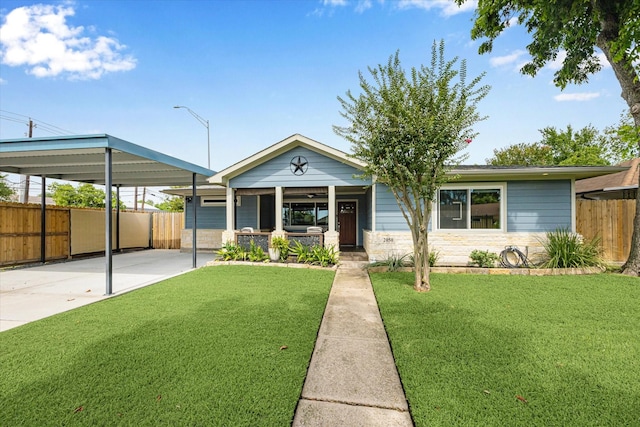2050 Marnel Rd, Houston, TX 77055 - view of front of home featuring a porch, stone siding, driveway, and a carport