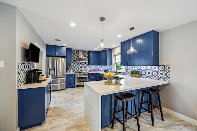 2050 Marnel Rd, Houston, TX 77055 - kitchen with blue cabinets, appliances with stainless steel finishes, wall chimney range hood, a peninsula, and recessed lighting