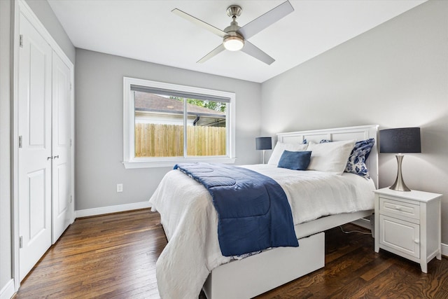 2050 Marnel Rd, Houston, TX 77055 - bedroom with dark wood-style flooring, baseboards, a ceiling fan, and a closet