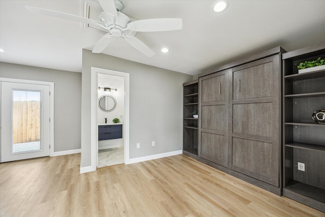 2050 Marnel Rd, Houston, TX 77055 - unfurnished bedroom with baseboards, light wood finished floors, recessed lighting, ensuite bathroom, and ceiling fan