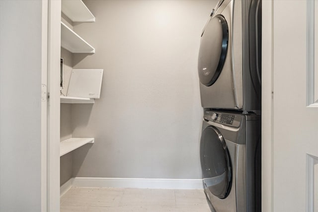 2050 Marnel Rd, Houston, TX 77055 - laundry room with estacked washer and dryer and baseboards