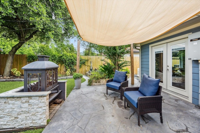2050 Marnel Rd, Houston, TX 77055 - fenced backyard with french doors and a patio