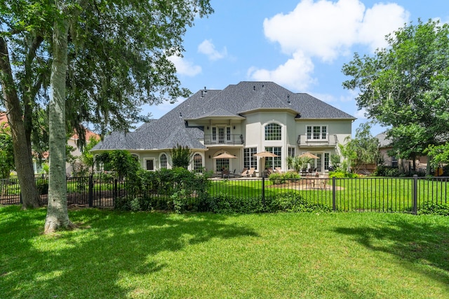 26 Commanders Pt, Missouri City, TX 77459 - rear view of property featuring stucco siding and a shingled roof