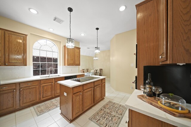 1123 Mariner Cv, Sugar Land, TX 77498 - kitchen featuring a sink, brown cabinets, a kitchen island, backsplash, and recessed lighting