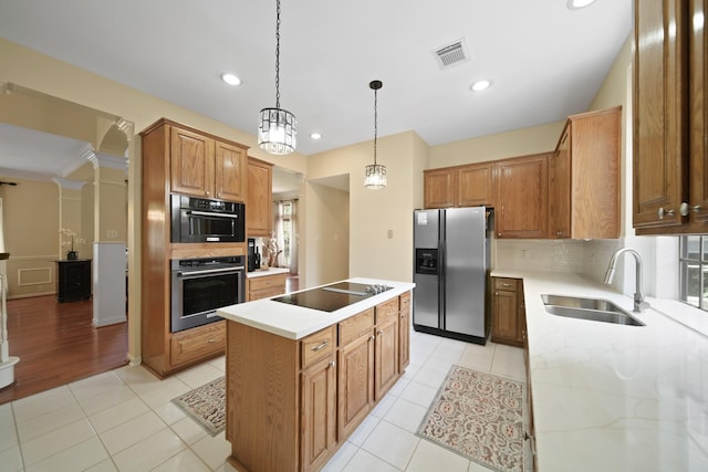 1123 Mariner Cv, Sugar Land, TX 77498 - kitchen with stainless steel refrigerator with ice dispenser, black electric stovetop, a sink, a kitchen island, and decorative backsplash
