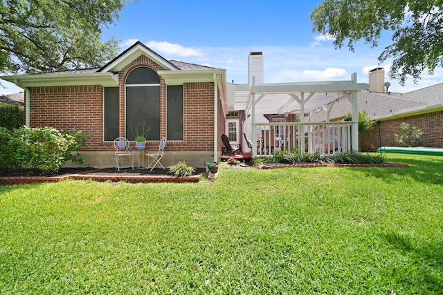 1123 Mariner Cv, Sugar Land, TX 77498 - view of front of home featuring brick siding, a front yard, a deck, and a chimney