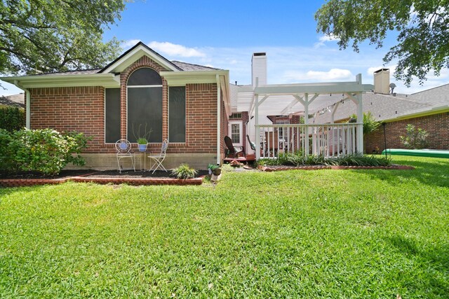 1123 Mariner Cv, Sugar Land, TX 77498 - view of front facade featuring brick siding, a front lawn, a deck, and a chimney