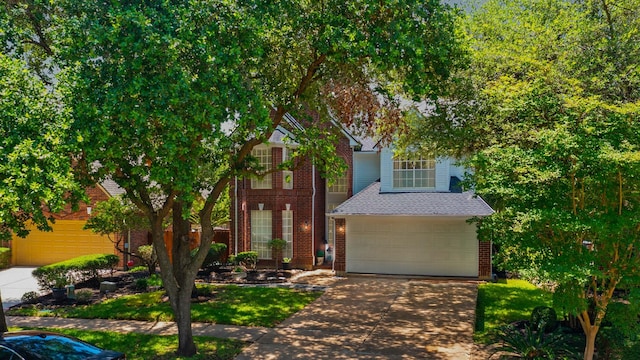 1123 Mariner Cv, Sugar Land, TX 77498 - view of front of house featuring brick siding, concrete driveway, a garage, and roof with shingles