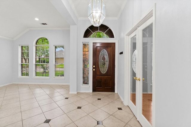 1030 Evandale Ln, Sugar Land, TX 77479 - foyer entrance featuring french doors, crown molding, baseboards, light tile patterned flooring, and a chandelier