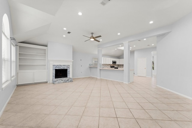 1030 Evandale Ln, Sugar Land, TX 77479 - unfurnished living room featuring a ceiling fan, lofted ceiling, recessed lighting, a fireplace, and light tile patterned floors