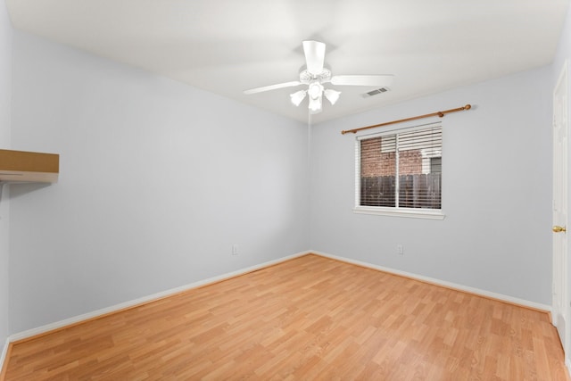 1030 Evandale Ln, Sugar Land, TX 77479 - unfurnished room with wood finished floors, baseboards, and ceiling fan