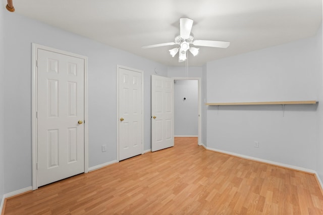 1030 Evandale Ln, Sugar Land, TX 77479 - unfurnished bedroom featuring wood finished floors, baseboards, and a ceiling fan