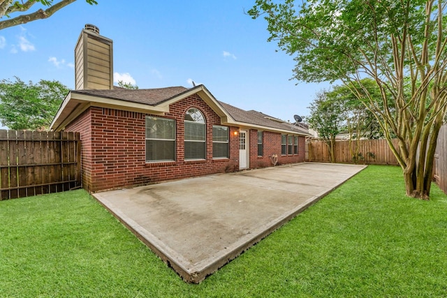 1030 Evandale Ln, Sugar Land, TX 77479 - rear view of property with a patio area, a chimney, brick siding, and roof with shingles