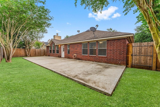 1030 Evandale Ln, Sugar Land, TX 77479 - rear view of house with a patio area, a chimney, and brick siding