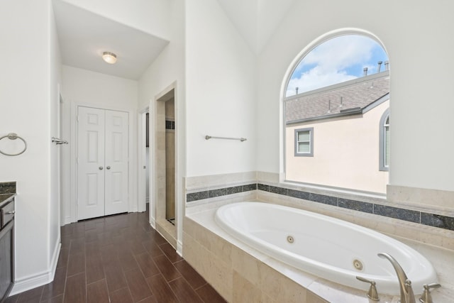 5731 Kansas St, Houston, TX 77007 - full bathroom with a whirlpool tub, vanity, and a shower stall
