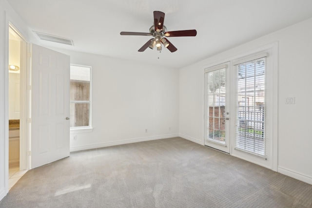 5731 Kansas St, Houston, TX 77007 - carpeted spare room featuring ceiling fan, french doors, and baseboards