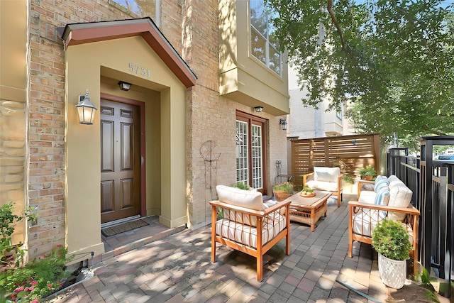 5731 Kansas St, Houston, TX 77007 - view of exterior entry with brick siding and an outdoor hangout area