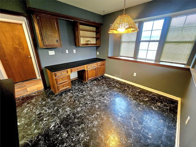 5000 Magnolia Ln, Bay City, TX 77414 - kitchen with dark countertops, brown cabinets, pendant lighting, baseboards, and open shelves