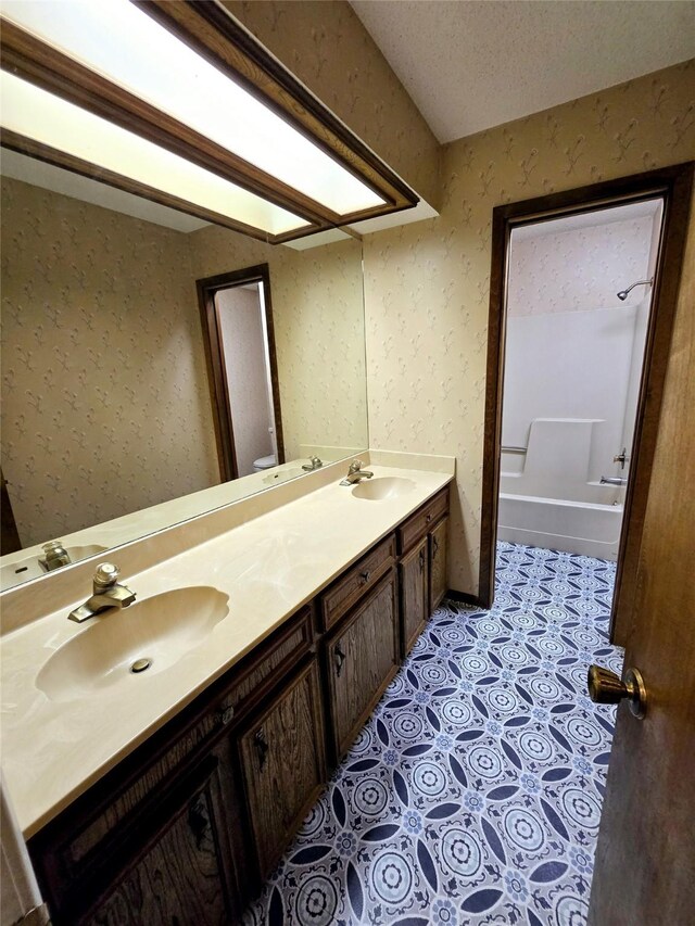 5000 Magnolia Ln, Bay City, TX 77414 - full bathroom featuring double vanity and a bath
