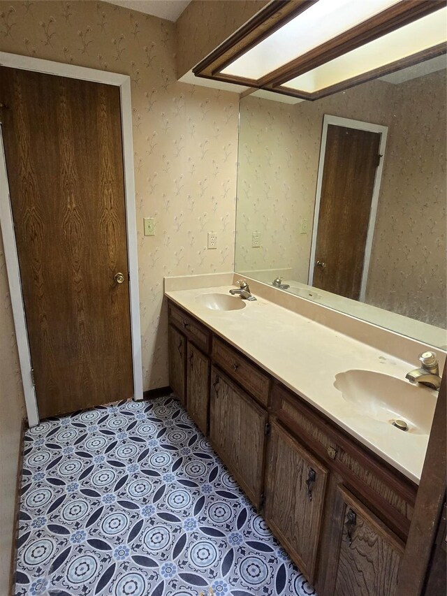 5000 Magnolia Ln, Bay City, TX 77414 - bathroom with double vanity and wallpapered walls