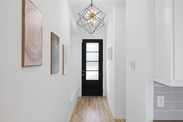 4234 Balboa Dr, Iowa Colony, TX 77583 - entryway featuring a chandelier, light wood-style flooring, and baseboards