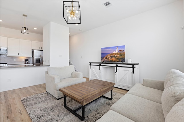 4234 Balboa Dr, Iowa Colony, TX 77583 - living room featuring light wood finished floors, recessed lighting, and stairway