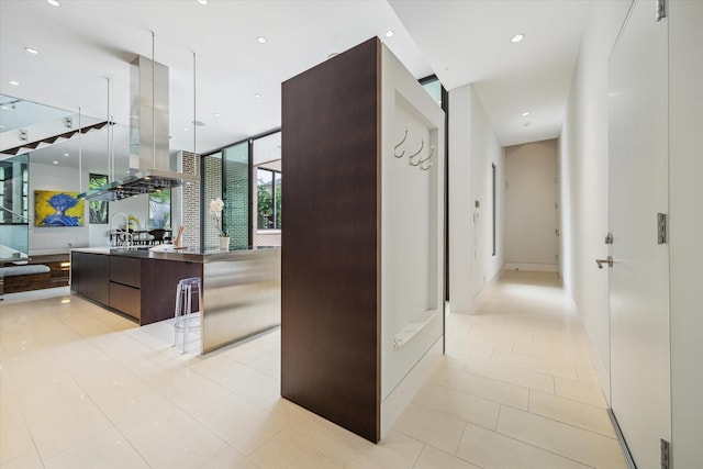 2110 Tangley St, Houston, TX 77005 - corridor with light tile patterned floors and recessed lighting