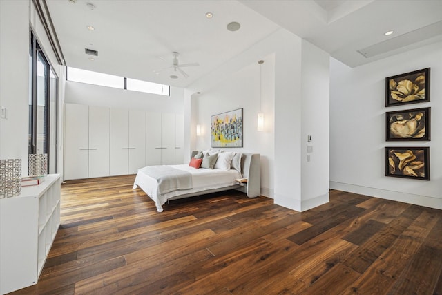 2110 Tangley St, Houston, TX 77005 - bedroom with dark wood-type flooring, multiple windows, ceiling fan, and recessed lighting