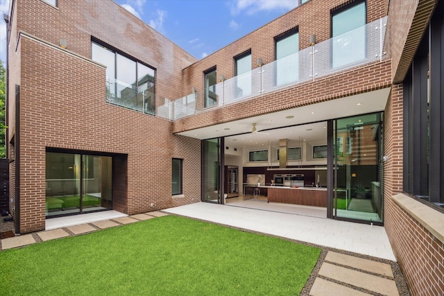 2110 Tangley St, Houston, TX 77005 - back of house featuring brick siding and a patio