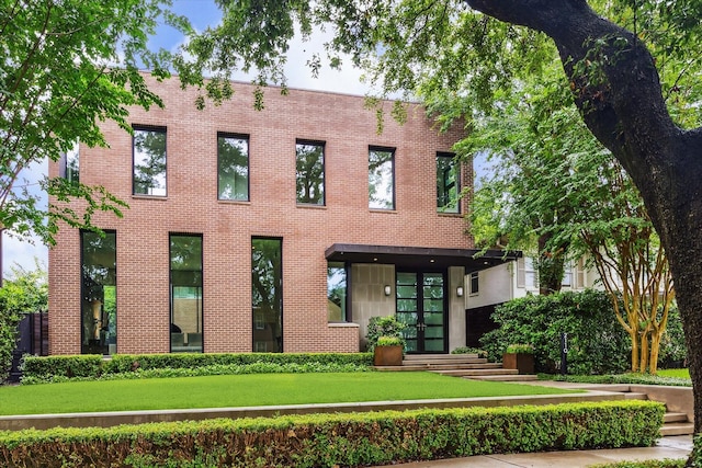 2110 Tangley St, Houston, TX 77005 - view of front of property featuring brick siding, a front yard, and french doors