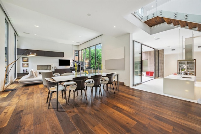 2110 Tangley St, Houston, TX 77005 - dining area featuring hardwood / wood-style floors, a skylight, and recessed lighting