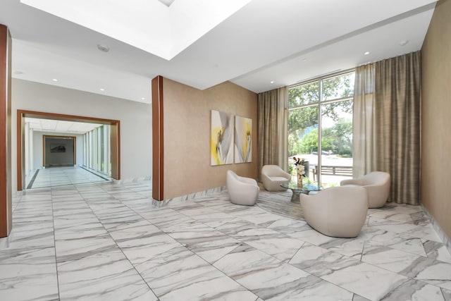 3333 Allen Pkwy Unit 1508, Houston, TX 77019 - sitting room with marble look tiles, recessed lighting, floor to ceiling windows, and a skylight