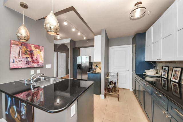 3333 Allen Pkwy Unit 1508, Houston, TX 77019 - kitchen with stainless steel refrigerator with ice dispenser, a sink, tasteful backsplash, light tile patterned flooring, and white cabinets