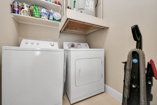3333 Allen Pkwy Unit 1508, Houston, TX 77019 - laundry area with separate washer and dryer, light tile patterned floors, water heater, and baseboards