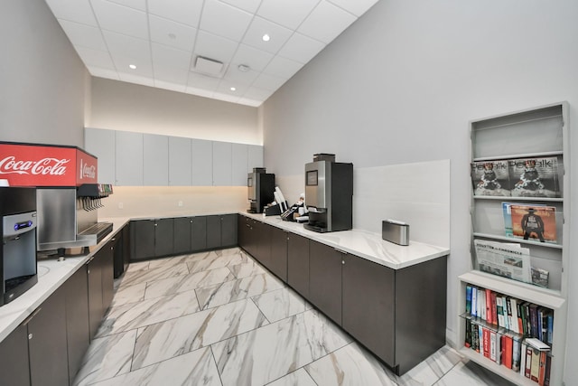 3333 Allen Pkwy Unit 1508, Houston, TX 77019 - kitchen with an office area, light countertops, light marble finish flooring, recessed lighting, and a paneled ceiling