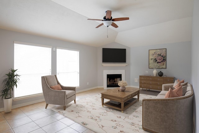 19915 Mason Creek Dr, Katy, TX 77449 - living room with a fireplace, light tile patterned floors, a ceiling fan, lofted ceiling, and baseboards