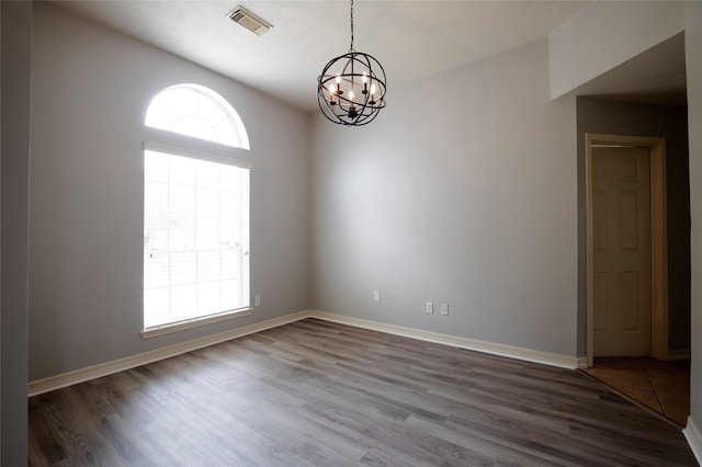 19915 Mason Creek Dr, Katy, TX 77449 - empty room featuring a chandelier, wood finished floors, and baseboards