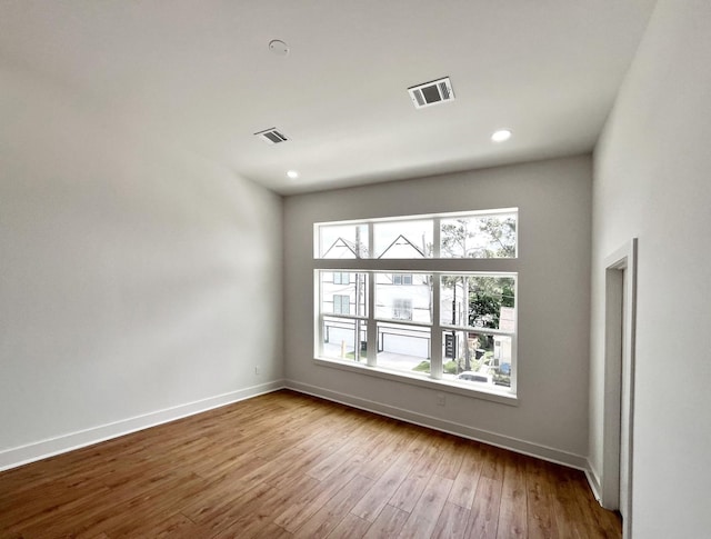 3109 Orange St, Houston, TX 77020 - unfurnished room with hardwood / wood-style flooring and recessed lighting