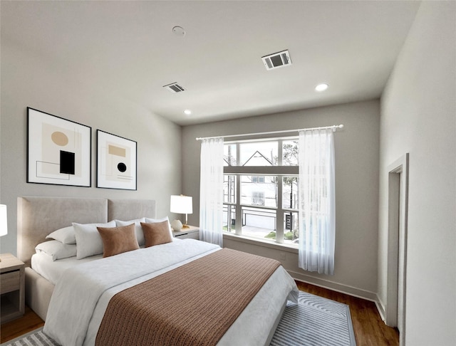 3109 Orange St, Houston, TX 77020 - bedroom with wood finished floors and recessed lighting
