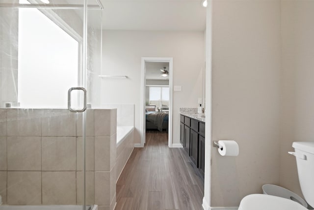 5330 Briana Dee Dr, Rosharon, TX 77583 - bathroom featuring a garden tub, a shower stall, connected bathroom, toilet, and a ceiling fan