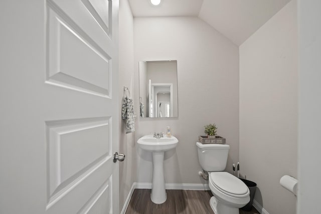 5330 Briana Dee Dr, Rosharon, TX 77583 - half bath with baseboards, toilet, wood finished floors, lofted ceiling, and a sink